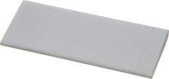 Norton - 4" Long x 1-3/4" Diam x 3/8" Thick, Novaculite Sharpening Stone - Round, Ultra Fine Grade - Eagle Tool & Supply