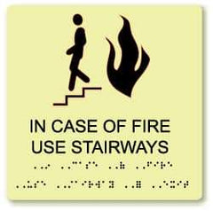 NMC - In Case of Fire - Use Stairway, Plastic Fire Sign - 8" Wide x 8" High, English/Braille, Glow-in-the-Dark - Eagle Tool & Supply