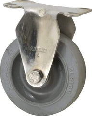 Albion - 4" Diam x 1-1/4" Wide x 5-1/8" OAH Top Plate Mount Rigid Caster - Soft Rubber, 410 Lb Capacity, Delrin Bearing, 2-1/2 x 3-5/8" Plate - Eagle Tool & Supply