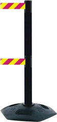 Tensator - 38" High, 2-1/2" Pole Diam, 4 Way Stanchion - 19" Base Diam, Octagon Recycled Rubber Base, Black Plastic Post, 7-1/2' x 2" Tape, Dual Line Tape, For Outdoor Use - Eagle Tool & Supply