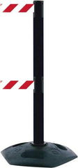 Tensator - 38" High, 2-1/2" Pole Diam, 4 Way Stanchion - 19" Base Diam, Octagon Recycled Rubber Base, Black Plastic Post, 7-1/2' x 2" Tape, Dual Line Tape, For Outdoor Use - Eagle Tool & Supply