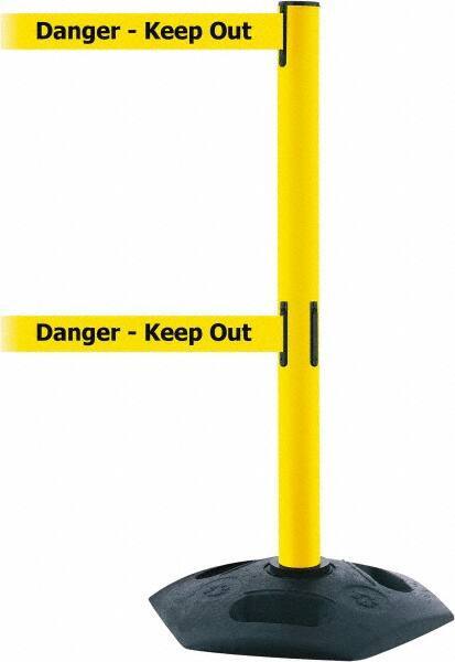 Tensator - 38" High, 2-1/2" Pole Diam, 4 Way Stanchion - 19" Base Diam, Octagon Recycled Rubber Base, Yellow Plastic Post, 7-1/2' x 2" Tape, Dual Line Tape, For Outdoor Use - Eagle Tool & Supply