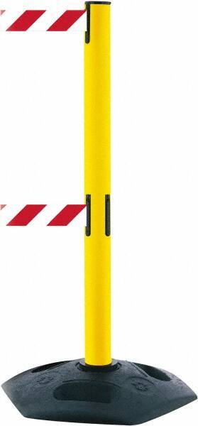 Tensator - 38" High, 2-1/2" Pole Diam, 4 Way Stanchion - 19" Base Diam, Octagon Recycled Rubber Base, Yellow Plastic Post, 7-1/2' x 2" Tape, Dual Line Tape, For Outdoor Use - Eagle Tool & Supply