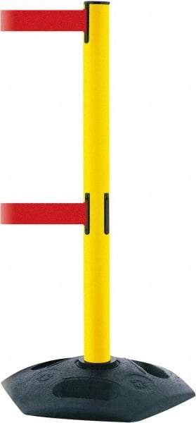 Tensator - 38" High, 2-1/2" Pole Diam, 4 Way Stanchion - 19" Base Diam, Octagon Recycled Rubber Base, Yellow Plastic Post, 7-1/2' x 2" Tape, Dual Line Tape, For Outdoor Use - Eagle Tool & Supply