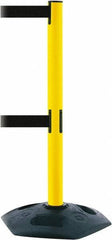 Tensator - 38" High, 2-1/2" Pole Diam, 4 Way Stanchion - 19" Base Diam, Octagon Recycled Rubber Base, Yellow Plastic Post, 13' x 2" Tape, Dual Line Tape, For Outdoor Use - Eagle Tool & Supply