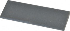 Norton - 4-1/2" Long x 1-3/4" Diam x 1/2" Thick, Silicon Carbide Sharpening Stone - Round, Fine Grade - Eagle Tool & Supply