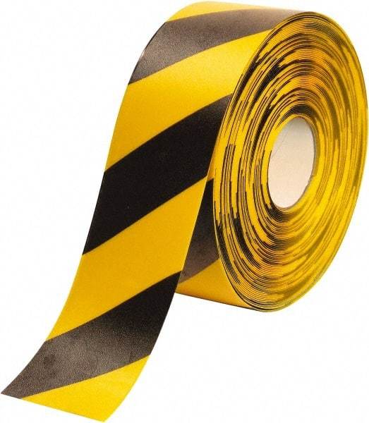 PRO-SAFE - Black & Yellow Striped PVC Tape - 4" Wide x 100' Long x 50 mil Thick, General Traffic - Eagle Tool & Supply