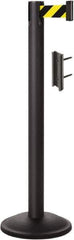 Lavi Industries - 38-1/2" High, 2-3/4" Pole Diam, Stanchion - 12-1/2" Base Diam, Round Steel Base, Black Steel Post, 7' x 2" Tape, Single Line Tape - Eagle Tool & Supply