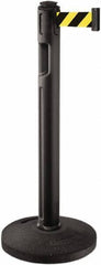Lavi Industries - 38-1/4" High, 3-1/4" Pole Diam, Stanchion - 16" Base Diam, Dome Recycled Rubber Base, Black Plastic Post, 12' x 2" Tape, Single Line Tape, For Outdoor Use - Eagle Tool & Supply