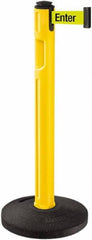 Lavi Industries - 38-1/4" High, 3-1/4" Pole Diam, Stanchion - 16" Base Diam, Dome Recycled Rubber Base, Yellow Plastic Post, 12' x 2" Tape, Single Line Tape, For Outdoor Use - Eagle Tool & Supply