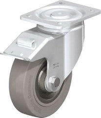 Blickle - 6-1/2" Diam x 1-31/32" Wide x 7-61/64" OAH Top Plate Mount Swivel Caster with Brake - Solid Rubber, 990 Lb Capacity, Ball Bearing, 5-1/2 x 4-3/8" Plate - Eagle Tool & Supply