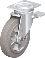 Blickle - 8" Diam x 2" Wide x 9-41/64" OAH Top Plate Mount Swivel Caster with Brake - Solid Rubber, 1,210 Lb Capacity, Ball Bearing, 5-1/2 x 4-3/8" Plate - Eagle Tool & Supply