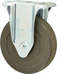 Albion - 5" Diam x 1-1/4" Wide x 6-15/32" OAH Top Plate Mount Rigid Caster - Hard Rubber, 290 Lb Capacity, Self-Lubricating Bearing, 2-7/8 x 3-5/8" Plate - Eagle Tool & Supply