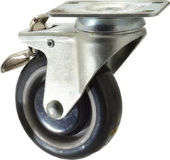 Value Collection - 4" Diam x 1-1/4" Wide x 5-13/32" OAH Top Plate Mount Swivel Caster with Brake - Polyurethane, 235 Lb Capacity, Ball Bearing, 2-7/8 x 3-5/8" Plate - Eagle Tool & Supply