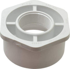 Value Collection - 4 x 2" PVC Plastic Pipe Bushing - Schedule 40, Spig x FIPT End Connections - Eagle Tool & Supply